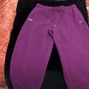 Nike fleece fitted joggers, purple with blue embroidered logo
